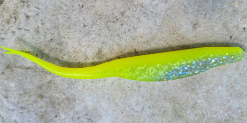 bait plastic lure with neon yellow body that glows in the dark and silver belly